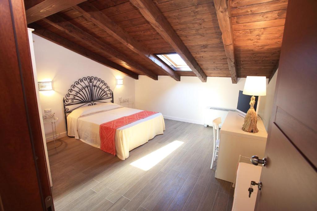 Postel nebo postele na pokoji v ubytování Inghirios Wellness Country Resort