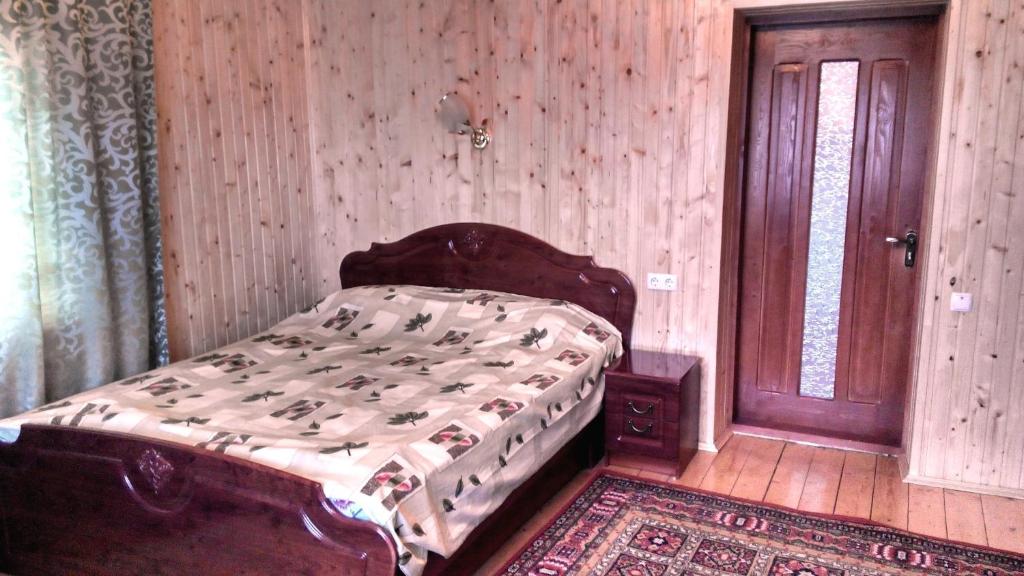 Postel nebo postele na pokoji v ubytování Cottage Ozerniy