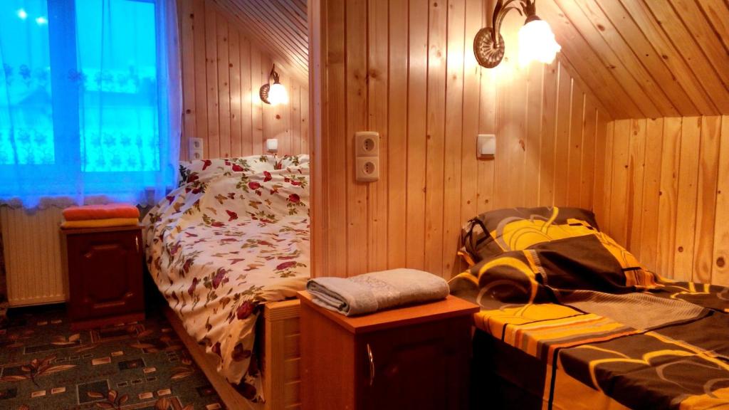 Postel nebo postele na pokoji v ubytování Cottage Ozerniy