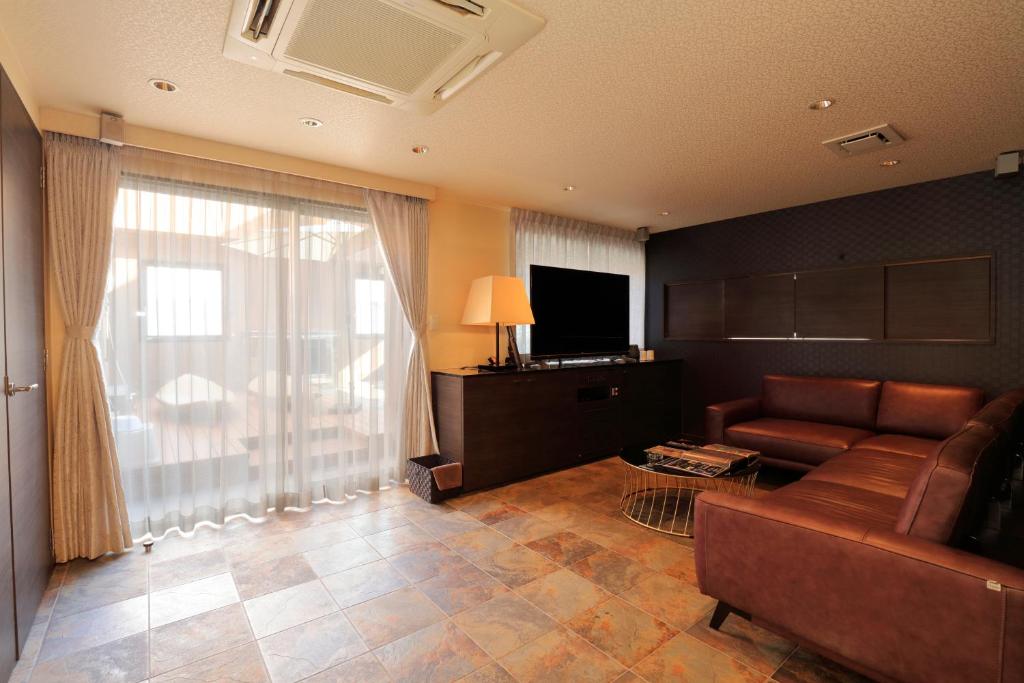 HOTEL felice Osaka -伊丹空港-にあるテレビまたはエンターテインメントセンター