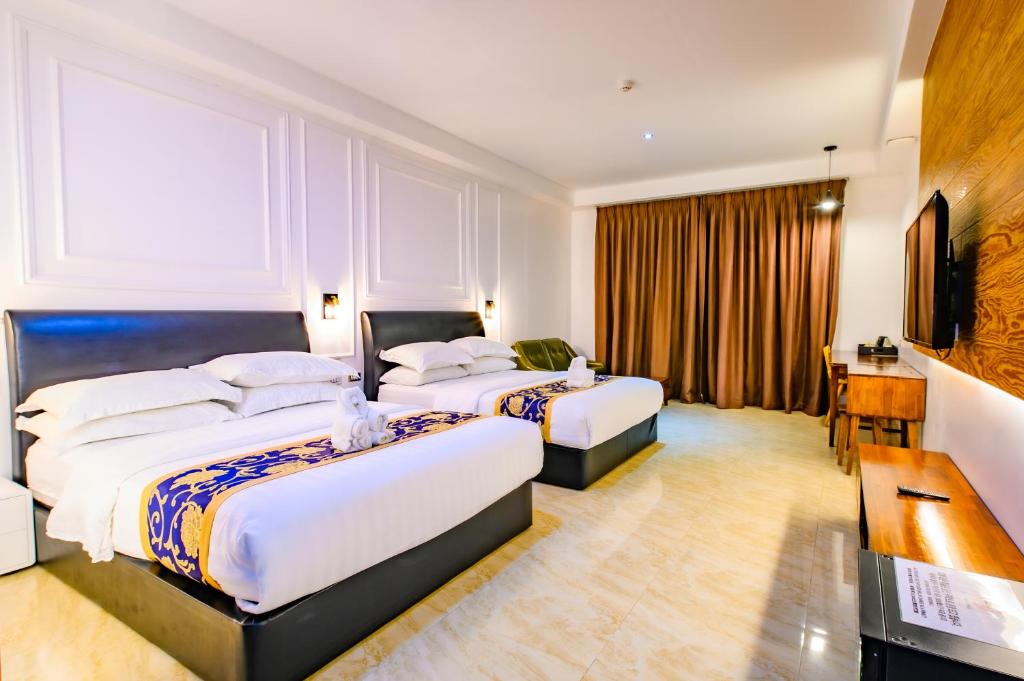 Postel nebo postele na pokoji v ubytování Hotel Seoul