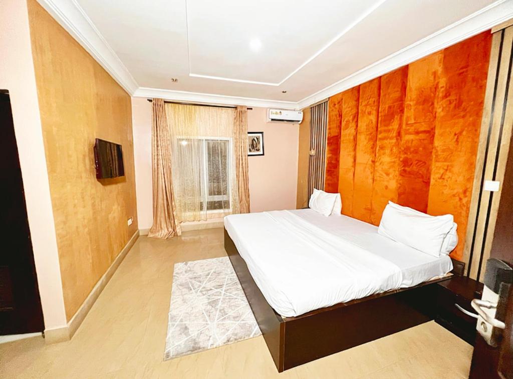 Postel nebo postele na pokoji v ubytování Grey Residence