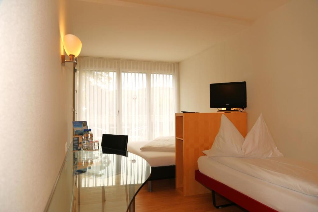 Postel nebo postele na pokoji v ubytování Hotel Seaside