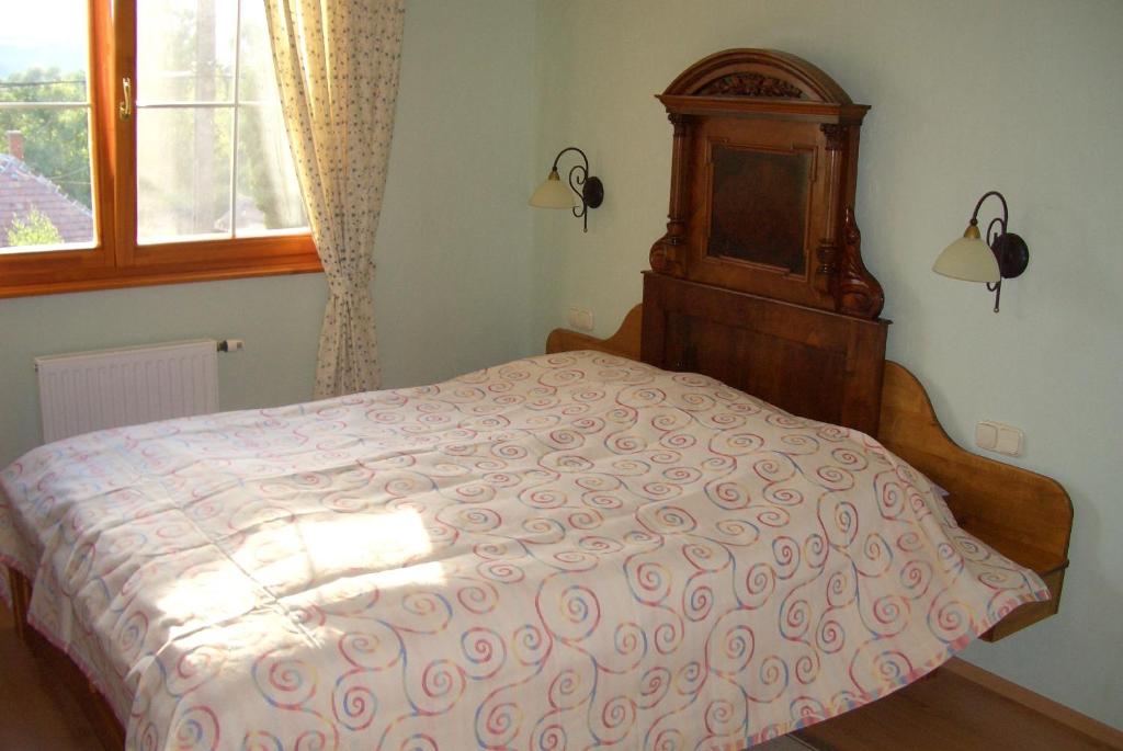 Postel nebo postele na pokoji v ubytování Bundi Vendégház