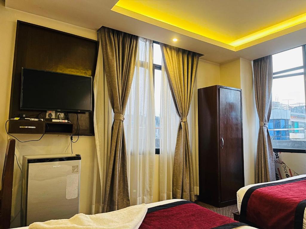 Postel nebo postele na pokoji v ubytování Hotel de Universal