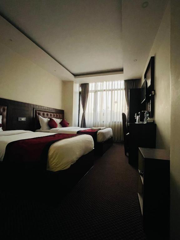 Postel nebo postele na pokoji v ubytování Hotel de Universal
