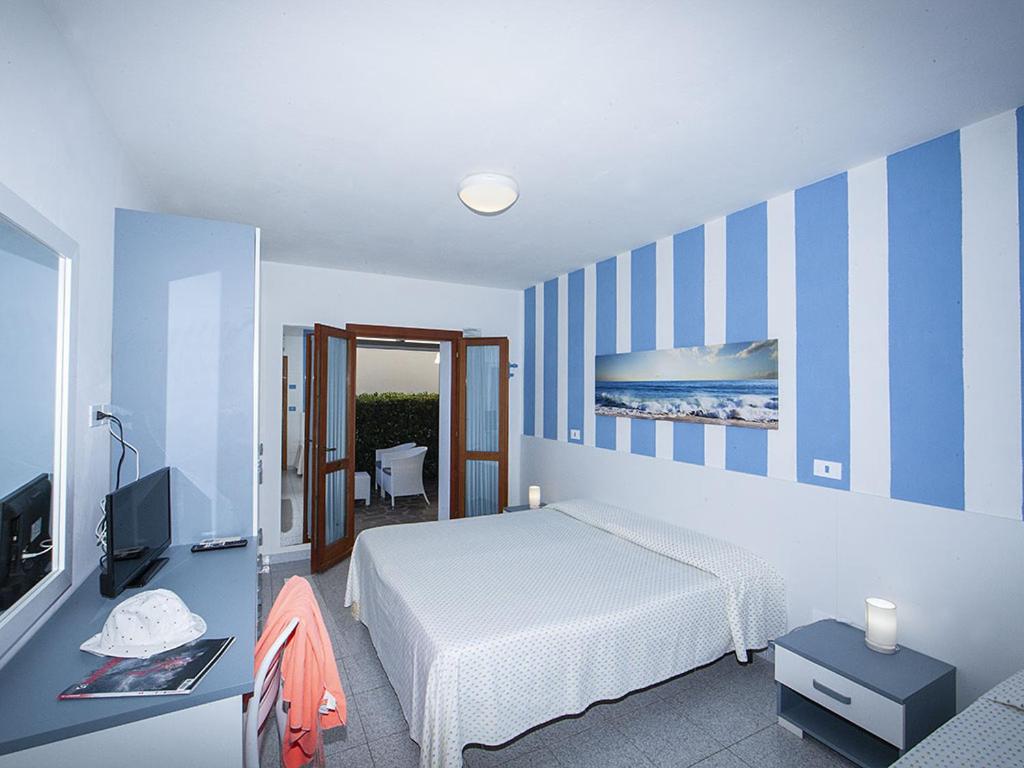 Postel nebo postele na pokoji v ubytování Hotel Aurora
