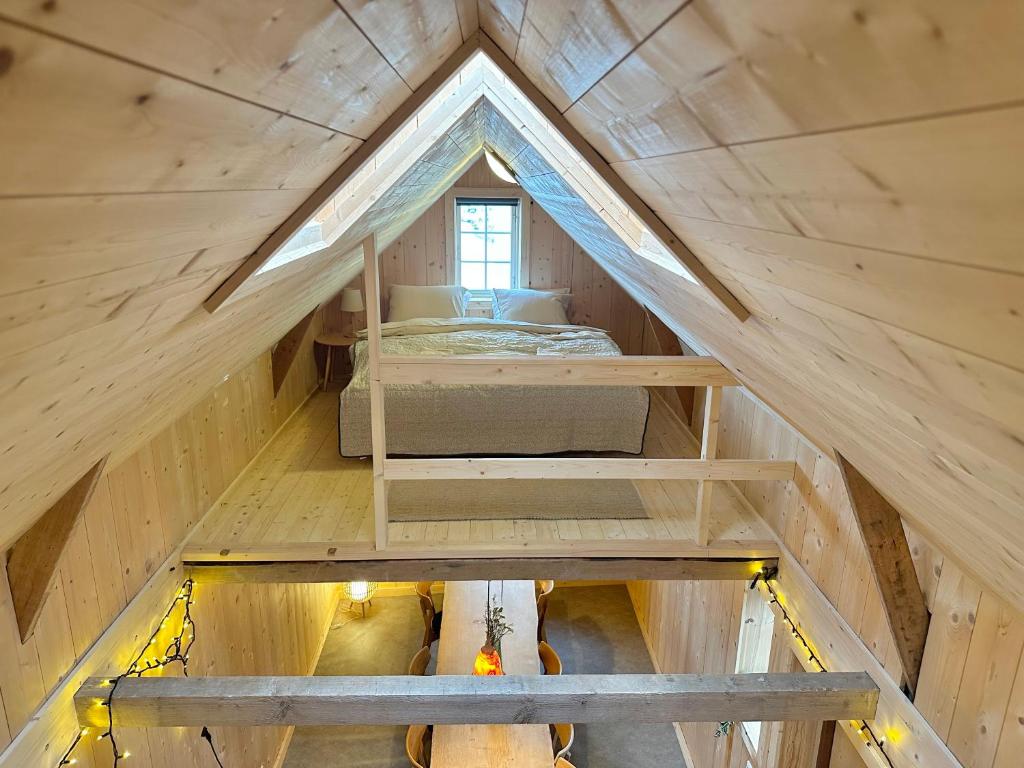 an overhead view of a bedroom in a tiny house at Boathouse in city centre with harbour view in Tórshavn