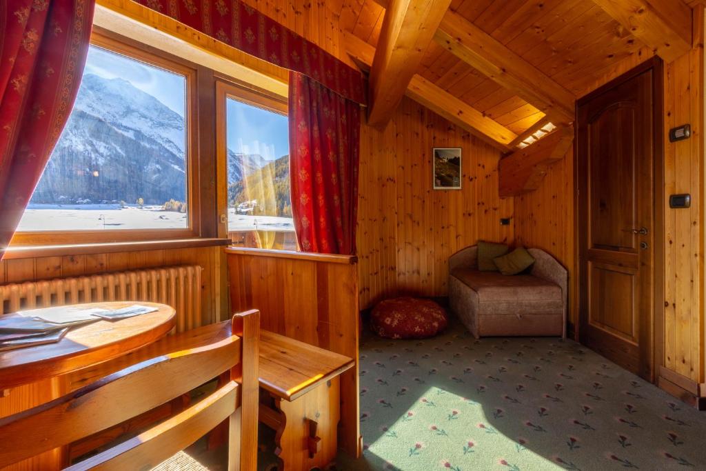 Posezení v ubytování Hotel Bouton D'Or - Cogne