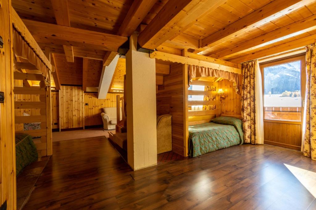 Postel nebo postele na pokoji v ubytování Hotel Bouton D'Or - Cogne