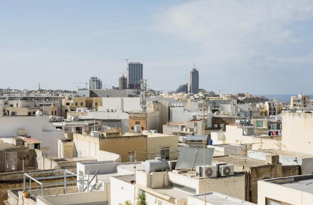 a view of a city with buildings at Hammock Vibes Town House in Sliema