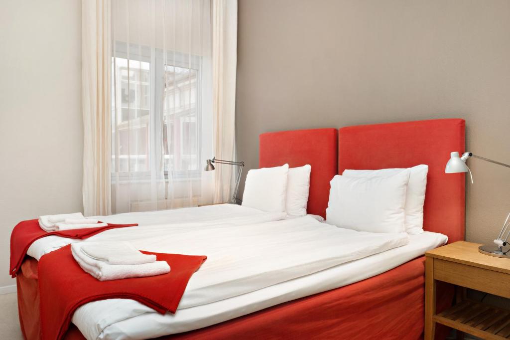 Postel nebo postele na pokoji v ubytování Stadsparken Apartments