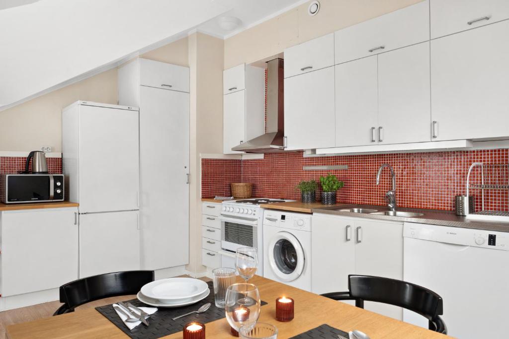 Kuchyň nebo kuchyňský kout v ubytování Stadsparken Apartments