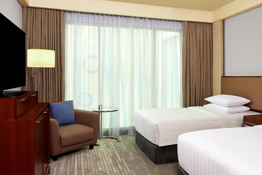Postel nebo postele na pokoji v ubytování Courtyard by Marriott Bandung Dago