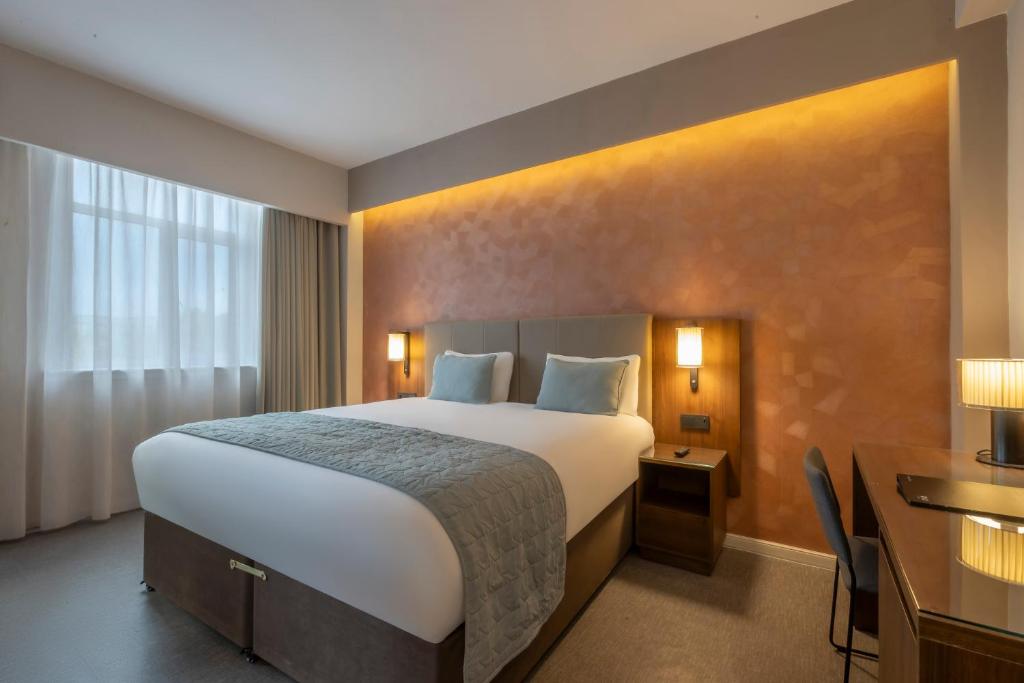 Voodi või voodid majutusasutuse Riu Plaza The Gresham Dublin toas