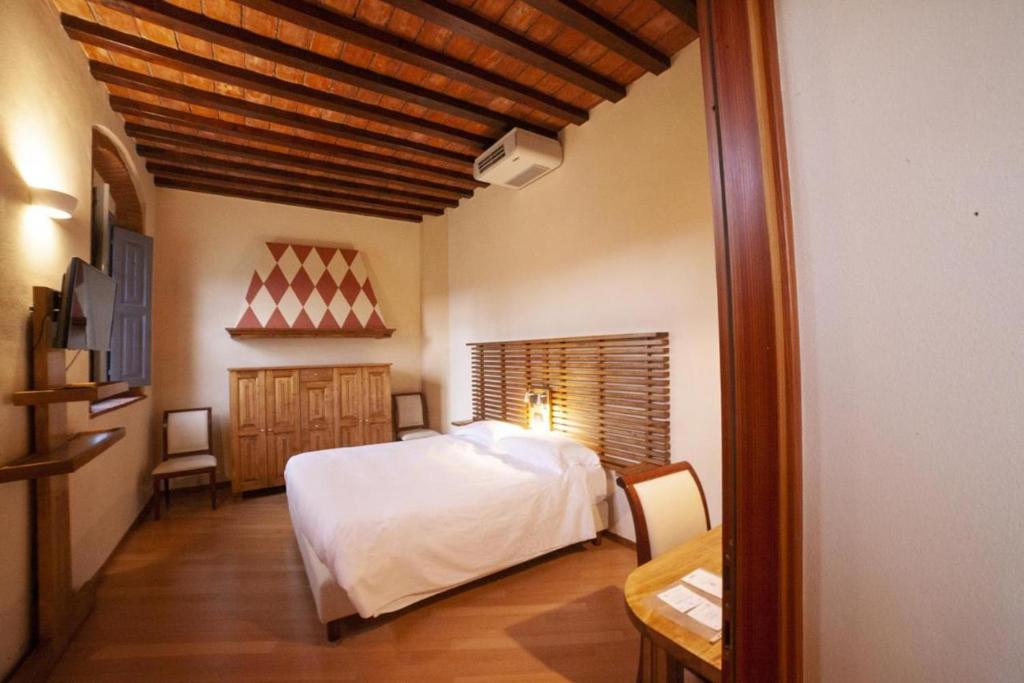 Postel nebo postele na pokoji v ubytování Agriturismo Cascina Farisengo