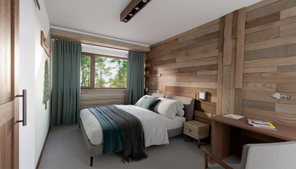 1 dormitorio con 1 cama y pared de madera en Breza Hotel Borovets en Borovets