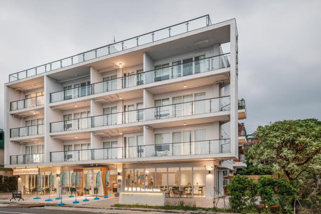 an exterior view of a building with balconies at The Ocean House in Shimen