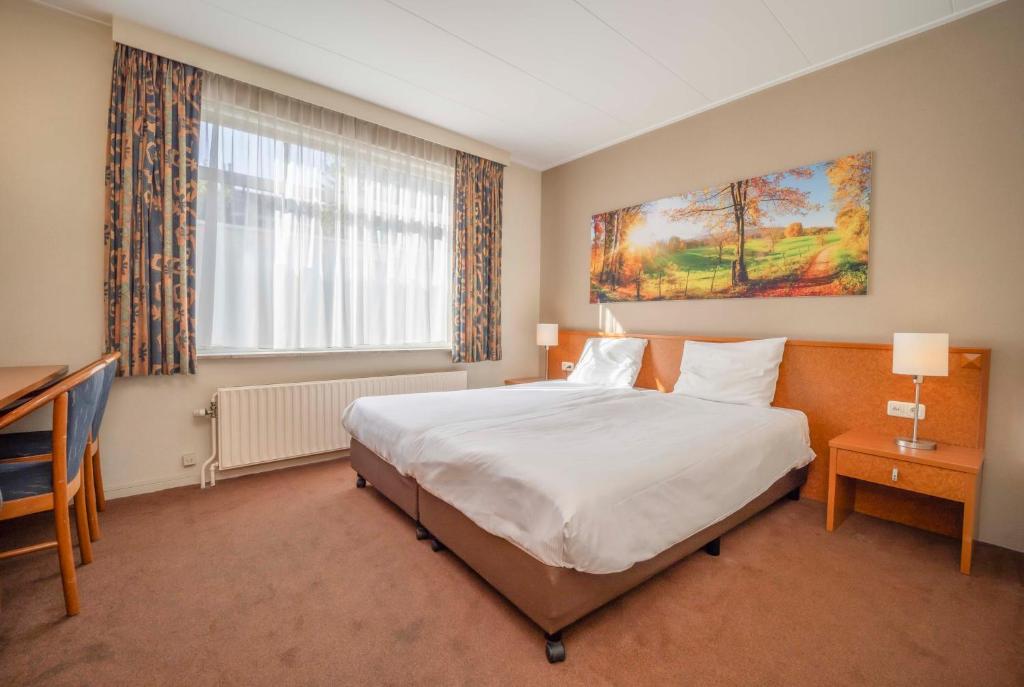 Postel nebo postele na pokoji v ubytování Fletcher Hotel-Restaurant Waalwijk