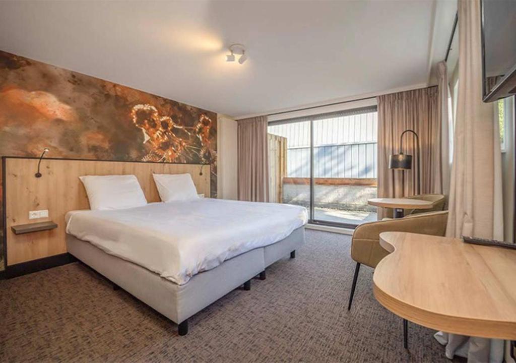 Postel nebo postele na pokoji v ubytování Fletcher Hotel-Restaurant Waalwijk