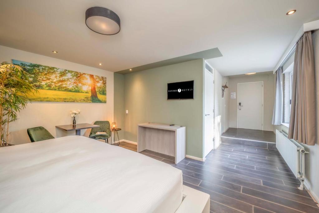 TV a/nebo společenská místnost v ubytování Fletcher Hotel-Restaurant Waalwijk