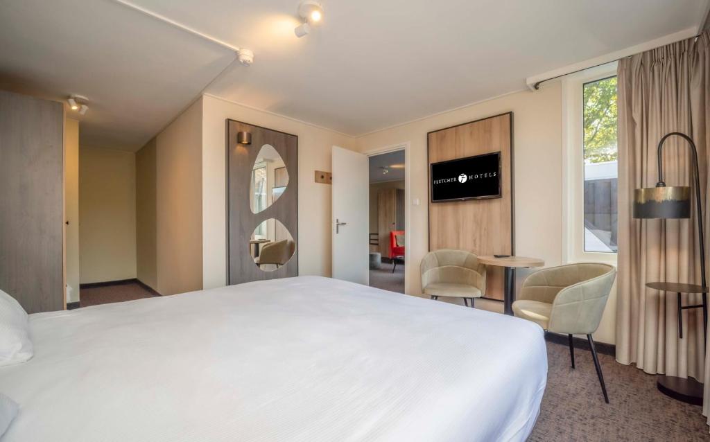Postel nebo postele na pokoji v ubytování Fletcher Hotel-Restaurant Waalwijk