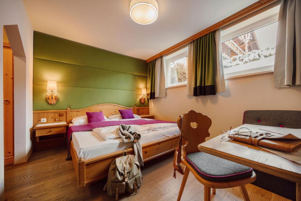 Postel nebo postele na pokoji v ubytování Hotel Lisa