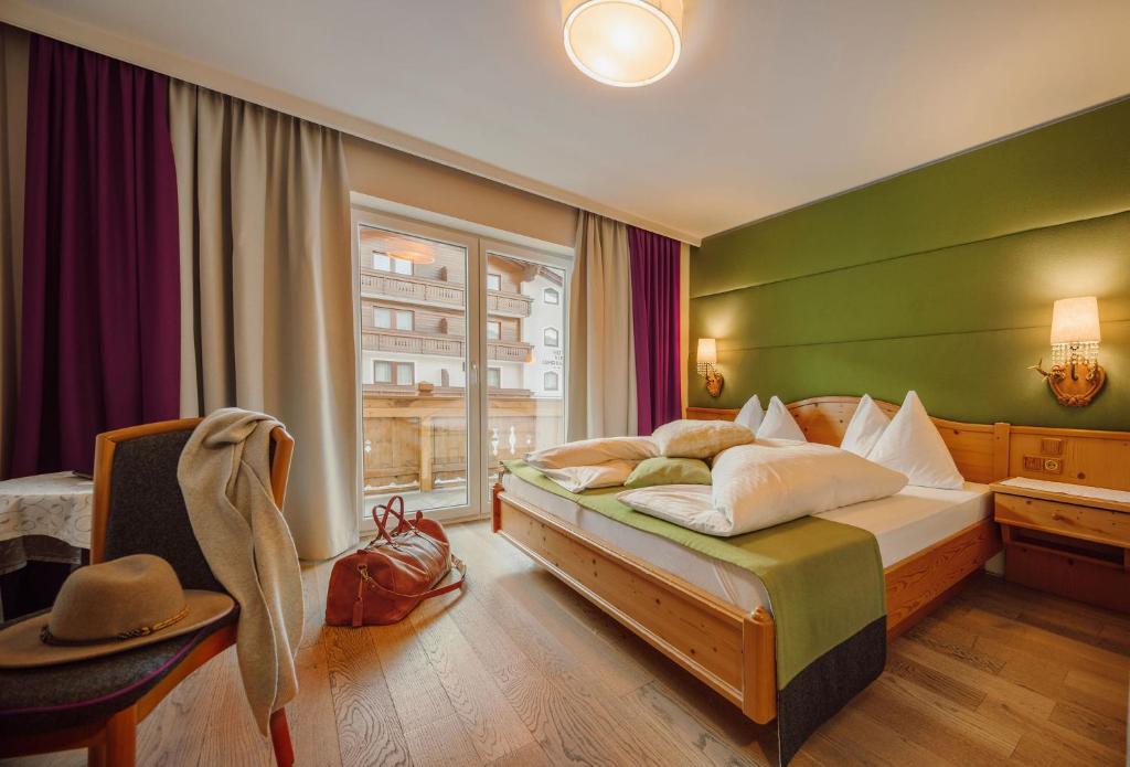 Postel nebo postele na pokoji v ubytování Hotel Lisa