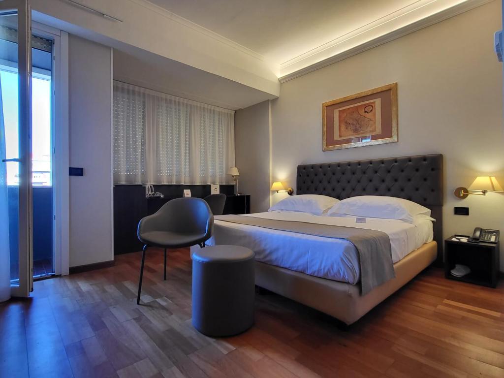 Postel nebo postele na pokoji v ubytování Hotel Plaza