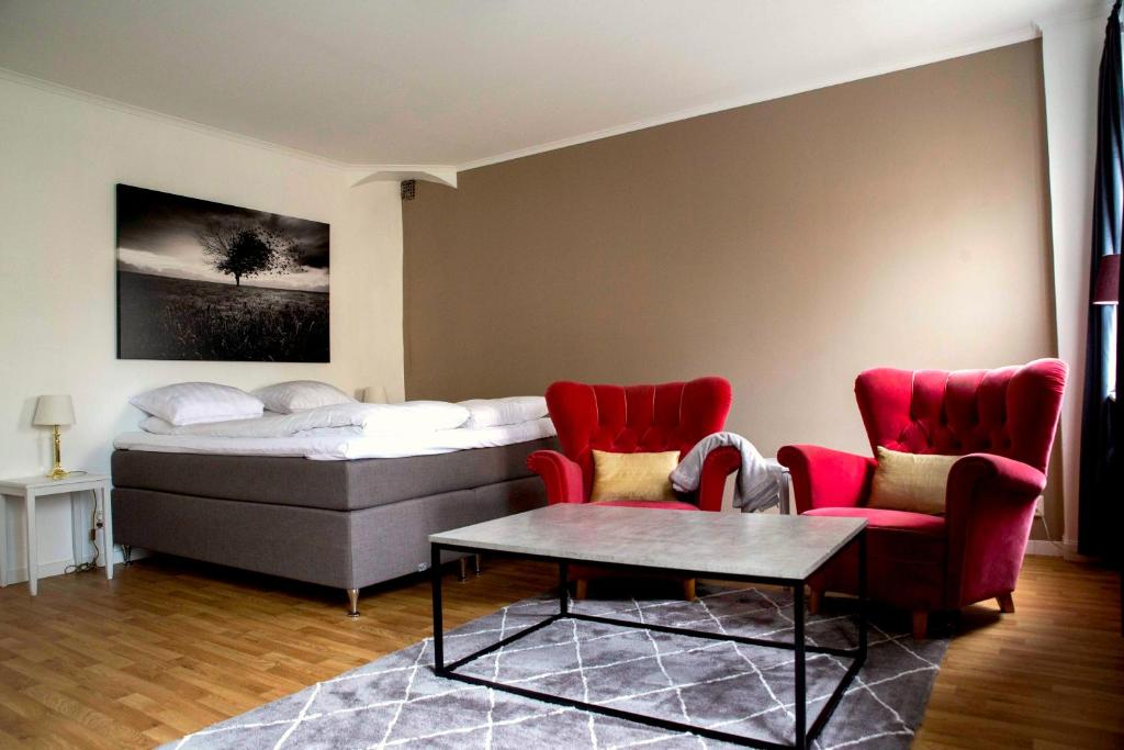 Postel nebo postele na pokoji v ubytování Eksjö Stadshotell Annex
