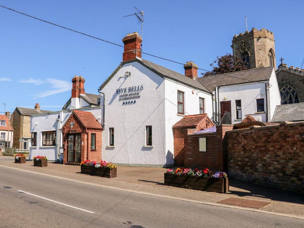 a white building on the side of a street at The Five Bells Inn in Wisbech