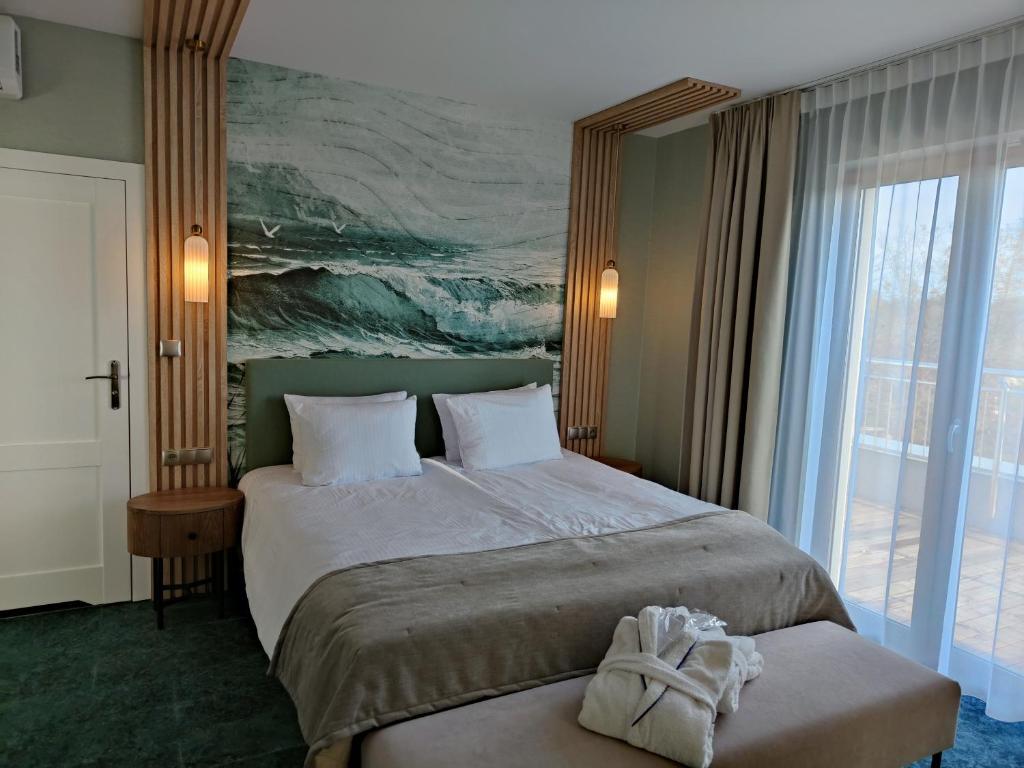 Postel nebo postele na pokoji v ubytování Hotel Szafir