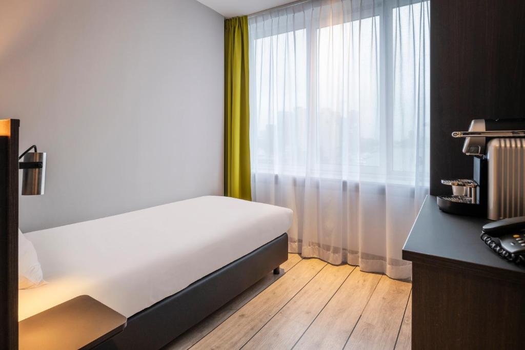 Postel nebo postele na pokoji v ubytování Thon Hotel Rotterdam City Centre
