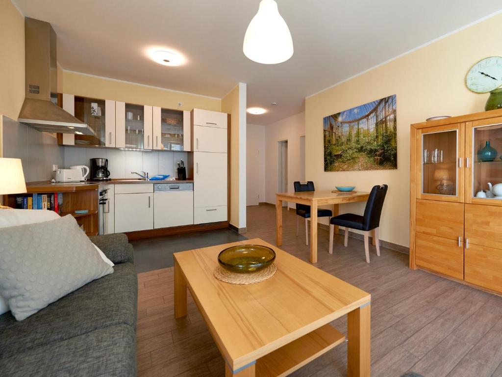 a living room with a couch and a table at Villa Annika - Apt. 08 in Ostseebad Sellin