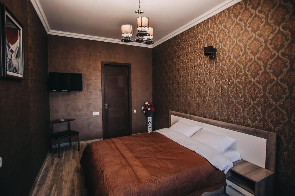 Postel nebo postele na pokoji v ubytování 7 Rooms Hotel