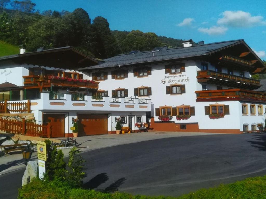 a large white building with a lot of windows at Apartment IN2- 2 Zimmer max- 3 Personen by Interhome in Saalbach Hinterglemm
