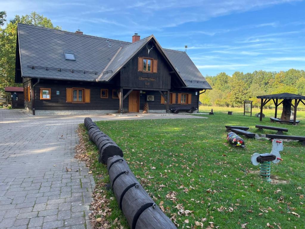 a house with two ducks in the grass in front of it at Holiday Home Mazurova chalupa by Interhome in Býšť