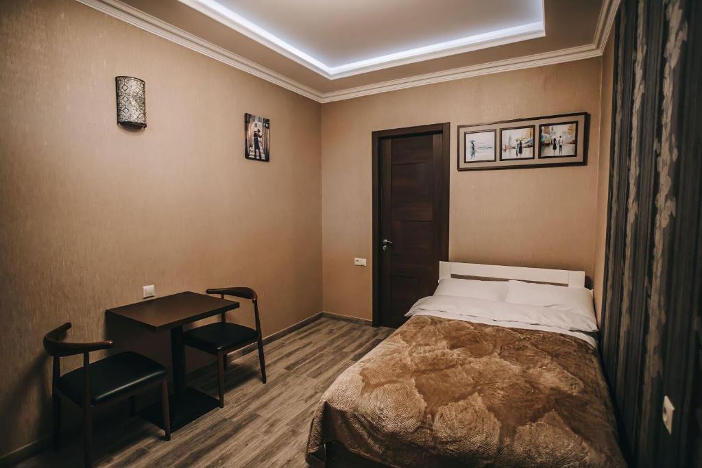 Postel nebo postele na pokoji v ubytování 7 Rooms Hotel