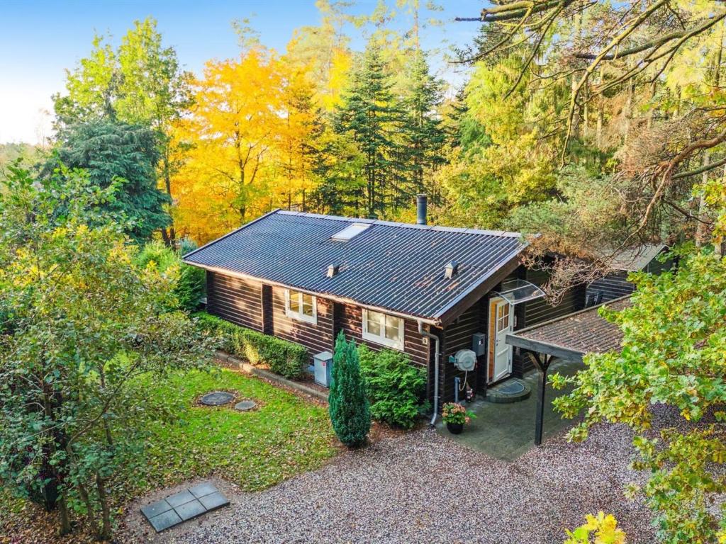 an overhead view of a house in the woods at Holiday Home Eddi - 10km from the sea in Djursland and Mols by Interhome in Rønde