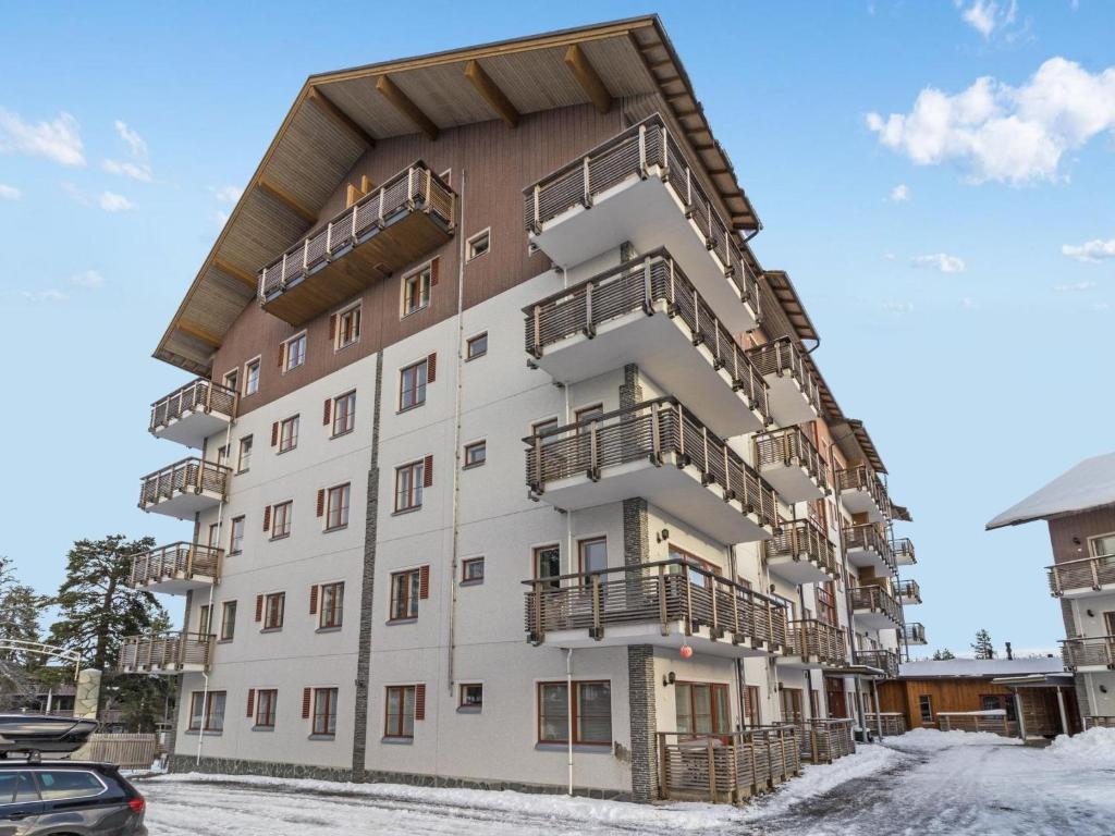 an apartment building with balconies on the side of it at Holiday Home Kelotähti a 37 by Interhome in Saariselka