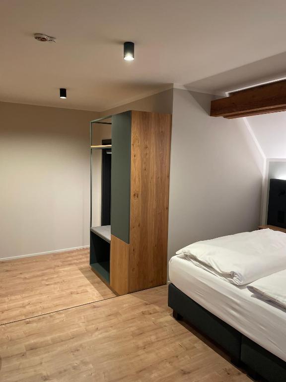 Postel nebo postele na pokoji v ubytování Hotel Gasthof Stieglers