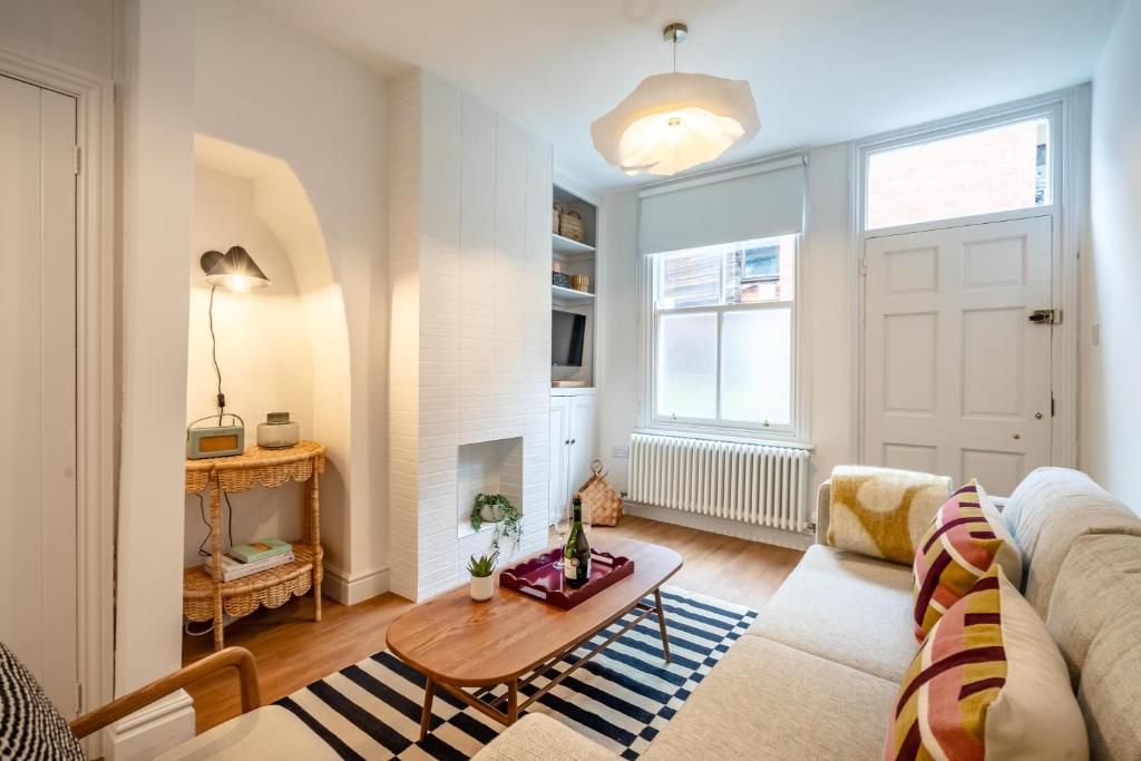 a living room with a couch and a table at 17 Trinity Lane in York