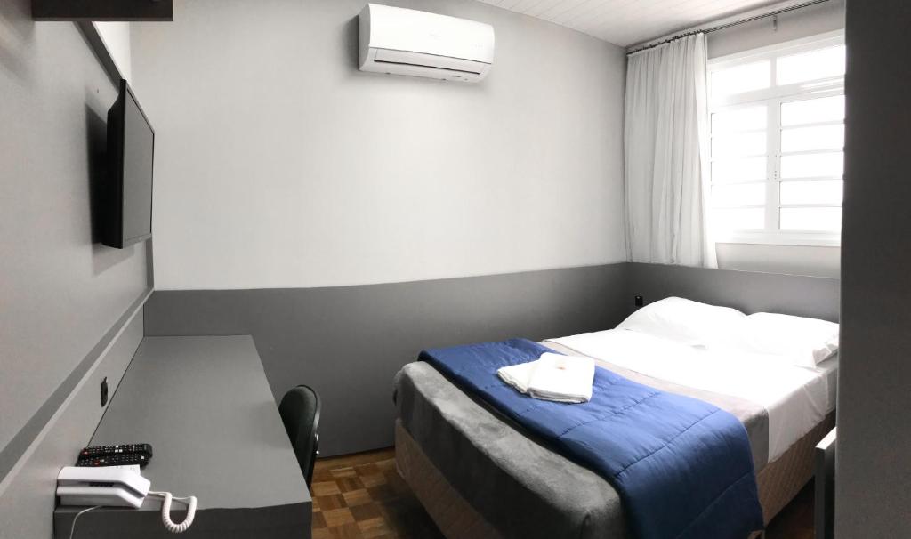 Postel nebo postele na pokoji v ubytování Nap Hotel