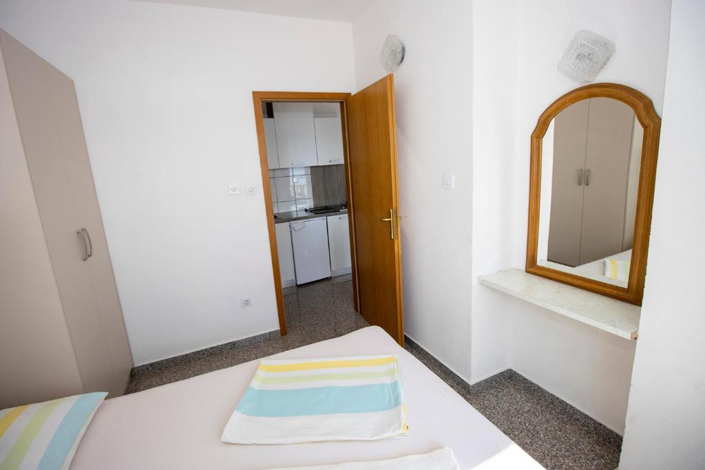 Postel nebo postele na pokoji v ubytování Apartmani Vesna