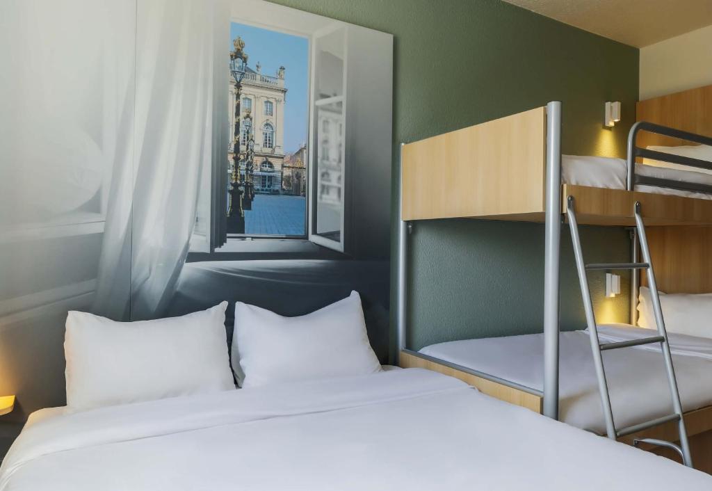 Postel nebo postele na pokoji v ubytování B&B HOTEL Nancy Laxou Zenith