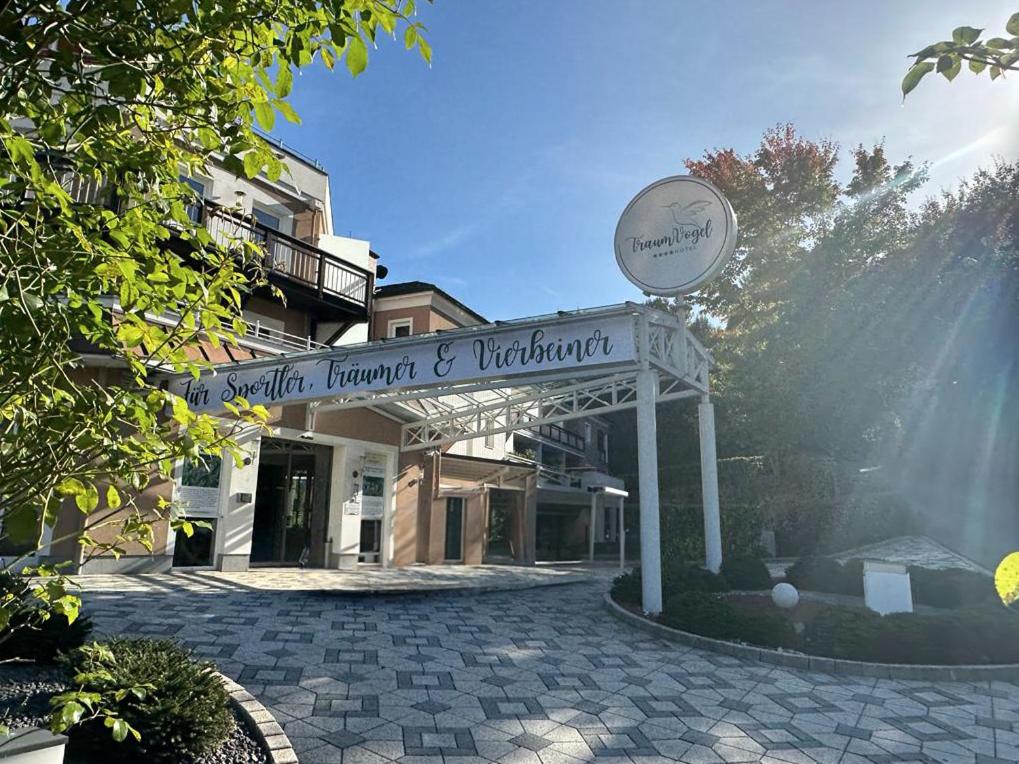 a building with a sign in front of it at Hotel TraumVogel in Jennersdorf