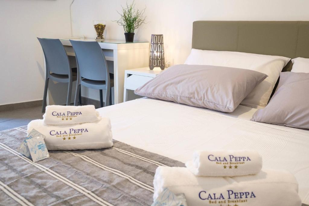 Posteľ alebo postele v izbe v ubytovaní B&B Cala Peppa