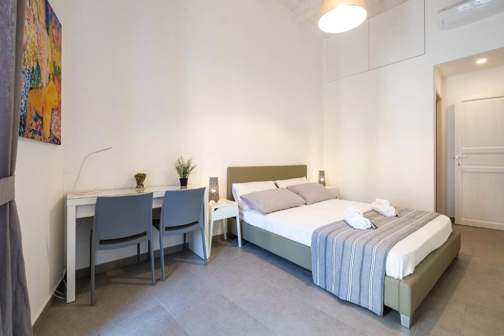 Posteľ alebo postele v izbe v ubytovaní B&B Cala Peppa
