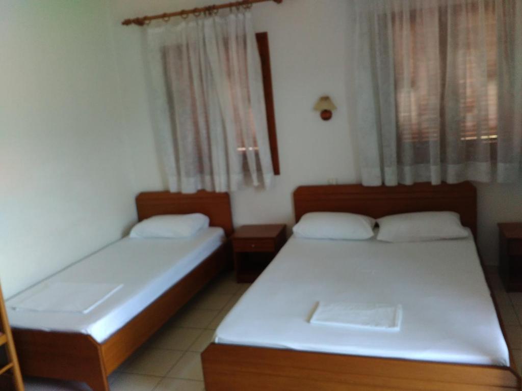 Posteľ alebo postele v izbe v ubytovaní Guesthouse Arsenis