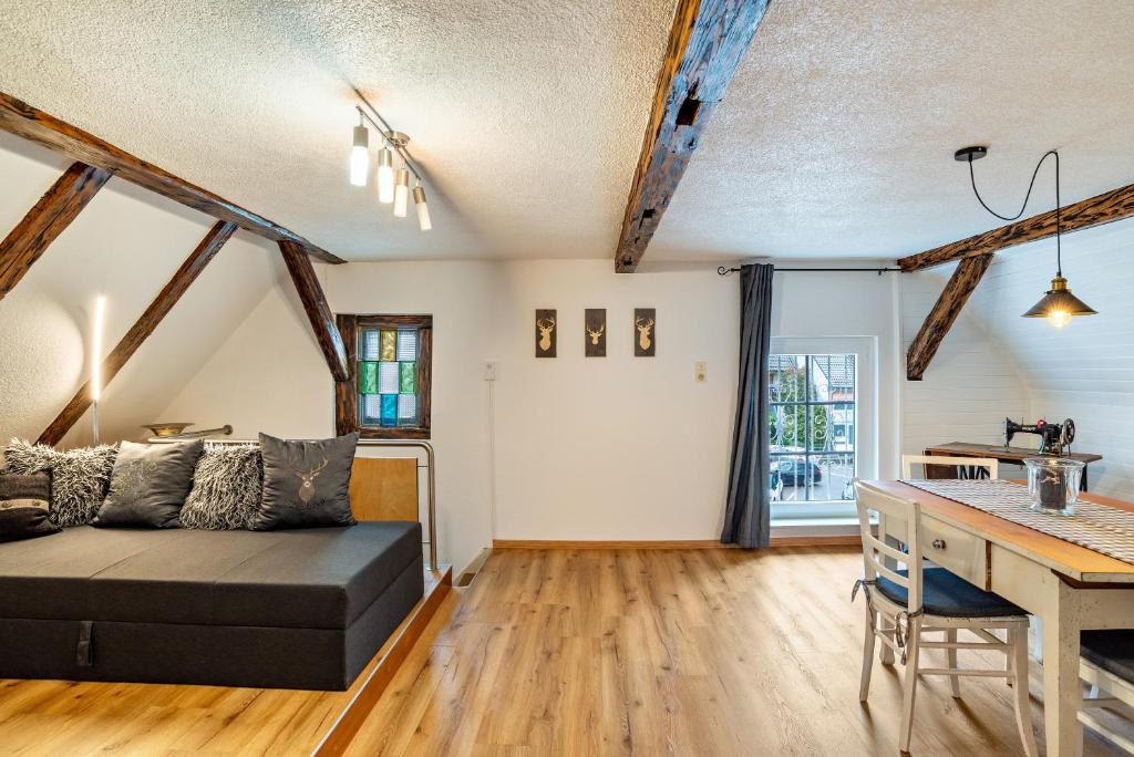 a living room with a couch and a table at Schwarzwaldtani - Städtle in Bühl